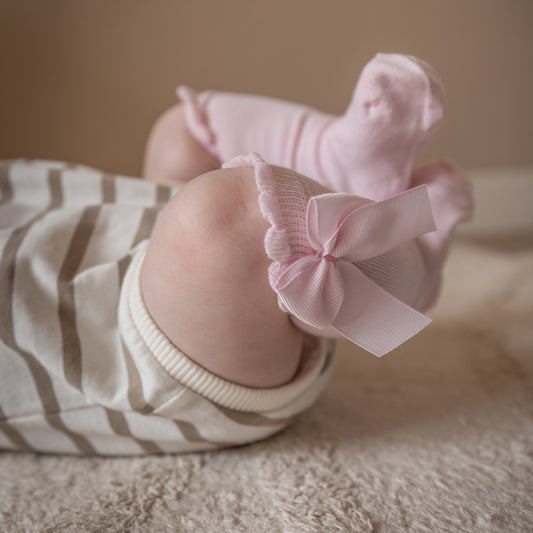 Kniekousen met strik - lichtroze