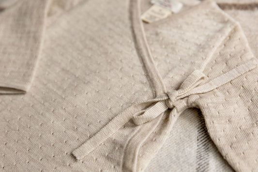 Copenhagen Colors - merino wollen overslag romper - pale cream melange