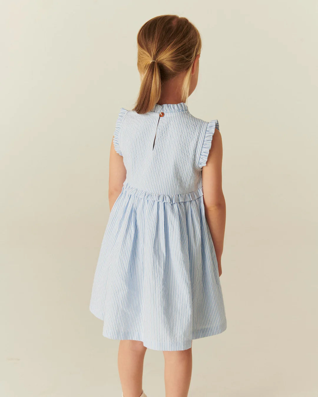 Copenhagen Colors - seersucker dress with ruffle - sky blue stripe
